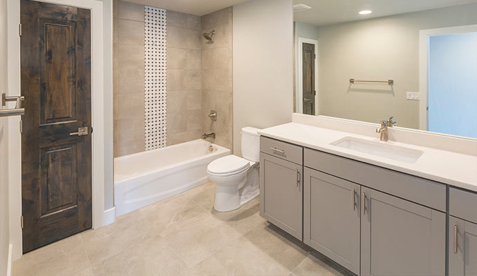 Modern bathroom interior with bathtub vanity and contemporary tile design