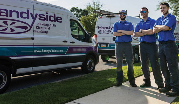 Professional Handyside service team with company vans.