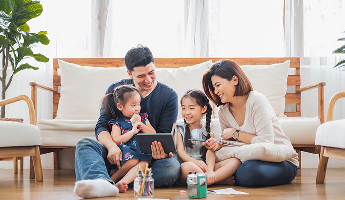 Happy family enjoying warmth in a cozy living room.