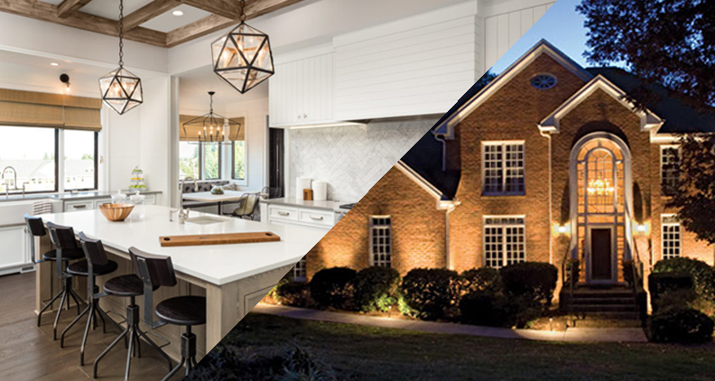 Communal table and pendant lamps shown beside the exterior of a well lit home and garden.